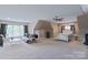 Large carpeted bedroom with a ceiling fan and large windows providing ample natural light at 8409 Olde Stonegate Ln, Mint Hill, NC 28227