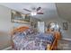 Bedroom with a wooden bed frame, ceiling fan, and neutral walls provides a serene setting at 8409 Olde Stonegate Ln, Mint Hill, NC 28227
