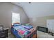 Bedroom featuring a bed, ceiling fan, and neutral walls provides a comfortable and simple room at 8409 Olde Stonegate Ln, Mint Hill, NC 28227