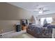 Cozy bedroom with soft carpet, ceiling fan, and warm neutral paint offers a relaxing retreat at 8409 Olde Stonegate Ln, Mint Hill, NC 28227
