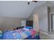 Bedroom featuring a bed, ceiling fan, and neutral walls provides a comfortable and simple room at 8409 Olde Stonegate Ln, Mint Hill, NC 28227