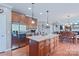 This spacious kitchen offers a center island, stainless steel appliances, and hardwood flooring at 8409 Olde Stonegate Ln, Mint Hill, NC 28227