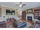 Open living room with fireplace and hardwood floors, perfect for relaxation and entertaining at 8409 Olde Stonegate Ln, Mint Hill, NC 28227