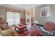 Comfortable living room with hardwood floors and elegant furniture at 8409 Olde Stonegate Ln, Mint Hill, NC 28227