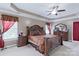 Inviting main bedroom with tray ceiling, large bed, and comfortable furnishings at 8409 Olde Stonegate Ln, Mint Hill, NC 28227