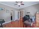 Spacious office area with hardwood floors and neutral walls featuring adjacent bathroom at 8409 Olde Stonegate Ln, Mint Hill, NC 28227