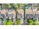 This aerial view highlights the home's roofline, the driveway, and the surrounding green trees in the neighborhood at 9429 Ridgeforest Dr, Charlotte, NC 28277