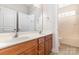 Bathroom vanity with double sinks and cabinetry plus a view of tub and shower at 9429 Ridgeforest Dr, Charlotte, NC 28277