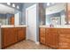 Dual vanity sinks with tile floor and view to a bedroom at 9429 Ridgeforest Dr, Charlotte, NC 28277
