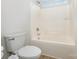 Clean bathroom featuring a toilet and shower combination, with a view of the bright window at 9429 Ridgeforest Dr, Charlotte, NC 28277