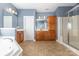 Primary bathroom with tub, shower, and and vanities at 9429 Ridgeforest Dr, Charlotte, NC 28277