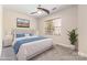 Bright bedroom featuring ceiling fan, window, and a tastefully designed bed and nightstands at 9429 Ridgeforest Dr, Charlotte, NC 28277