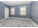 Cozy bedroom with plush carpeting, offering a comfortable and private retreat at 9429 Ridgeforest Dr, Charlotte, NC 28277
