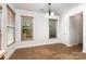 Dining Area features lots of natural light, tile floors, and chandelier lighting at 9429 Ridgeforest Dr, Charlotte, NC 28277