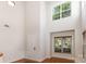 Bright foyer showcasing a high ceiling, hardwood floors, and large windows, creating a welcoming entrance at 9429 Ridgeforest Dr, Charlotte, NC 28277