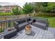 This is a beautiful deck with couches and a great view of the backyard at 10924 Owl Nest Ln, Charlotte, NC 28277