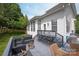 Spacious outdoor deck with seating, dining area, and a view of the backyard at 10924 Owl Nest Ln, Charlotte, NC 28277