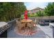 Outdoor deck with a dining table and chairs, perfect for entertaining guests at 10924 Owl Nest Ln, Charlotte, NC 28277