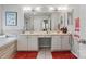 Bright bathroom featuring double sinks, a soaking tub, and a separate glass shower at 10924 Owl Nest Ln, Charlotte, NC 28277
