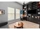 Bedroom featuring a built-in bookcase and cabinets, desk, and neutral carpet at 10924 Owl Nest Ln, Charlotte, NC 28277