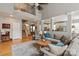 Open-concept living space with a balcony view and a seamless connection to the kitchen area at 10924 Owl Nest Ln, Charlotte, NC 28277
