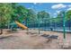 Community playground area featuring swings, slide, picnic tables, and climbing structure at 10924 Owl Nest Ln, Charlotte, NC 28277