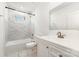 Modern bathroom featuring stylish marble tile in shower and floor with a white vanity at 1112 Concord Ave, Monroe, NC 28110