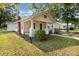 Charming home featuring a covered front porch and a well-manicured lawn at 1112 Concord Ave, Monroe, NC 28110