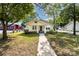 Home featuring a covered front porch and a well-manicured lawn at 1112 Concord Ave, Monroe, NC 28110