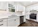 Updated kitchen featuring new countertops, stainless steel appliances, and modern white cabinetry at 1112 Concord Ave, Monroe, NC 28110
