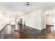 Open concept living space with updated lighting, seamless flow, and refinished wood floors at 1112 Concord Ave, Monroe, NC 28110