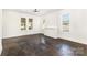 Bright living room with refinished hardwood floors, ample natural light, and fresh paint at 1112 Concord Ave, Monroe, NC 28110