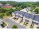 Aerial view of attractive townhomes featuring brick exteriors, attached garages, and mature landscaping at 1126 Roderick Dr, Fort Mill, SC 29708
