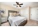 Comfortable bedroom featuring a tufted headboard, ceiling fan, and closet at 1126 Roderick Dr, Fort Mill, SC 29708