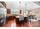 Open kitchen with a large island, stainless steel appliances, and hardwood floors at 1126 Roderick Dr, Fort Mill, SC 29708
