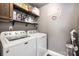 Functional laundry room with side-by-side washer and dryer, and ample shelving at 1126 Roderick Dr, Fort Mill, SC 29708