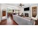 Inviting living room features a fireplace, hardwood floors, ceiling fan, and staircase at 1126 Roderick Dr, Fort Mill, SC 29708
