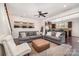 Open-concept living room boasts hardwood floors, comfortable seating, and easy kitchen access at 1126 Roderick Dr, Fort Mill, SC 29708