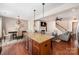 Spacious living room with fireplace, open to dining room, with hardwood floors and neutral decor at 1126 Roderick Dr, Fort Mill, SC 29708