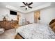 Relaxing main bedroom with carpet, ceiling fan, and access to an ensuite bathroom at 1126 Roderick Dr, Fort Mill, SC 29708