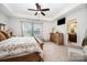 Bright main bedroom with tray ceiling, ceiling fan, and ensuite bathroom at 1126 Roderick Dr, Fort Mill, SC 29708