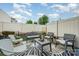 Cozy patio area with seating, a decorative rug, and a privacy fence at 1126 Roderick Dr, Fort Mill, SC 29708