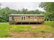 The home features a nice deck and a large backyard at 1245 Forest Ridge Rd, Bessemer City, NC 28016