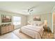 Bright bedroom with hardwood floors, ceiling fan, neutral walls, and tastefully coordinated furnishings at 1245 Forest Ridge Rd, Bessemer City, NC 28016