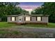 Charming single-story home with neutral siding, black shutters, and a well-manicured front lawn at 1245 Forest Ridge Rd, Bessemer City, NC 28016