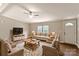 Cozy living room features neutral paint, a ceiling fan, and a view to the home's exterior at 1245 Forest Ridge Rd, Bessemer City, NC 28016