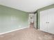Bedroom featuring neutral carpet, and double door closet at 12529 Old Timber Rd, Charlotte, NC 28269