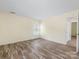 Bright bedroom features hardwood floors and neutral walls at 12529 Old Timber Rd, Charlotte, NC 28269