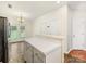 Kitchen area featuring an island, doors to the backyard, and stainless steel refrigerator at 12529 Old Timber Rd, Charlotte, NC 28269