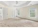 Spacious main bedroom features tray ceilings, carpet and large windows at 12529 Old Timber Rd, Charlotte, NC 28269
